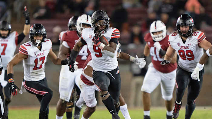 Utah's Tavion Thomas runs with the ball vs. Stanford